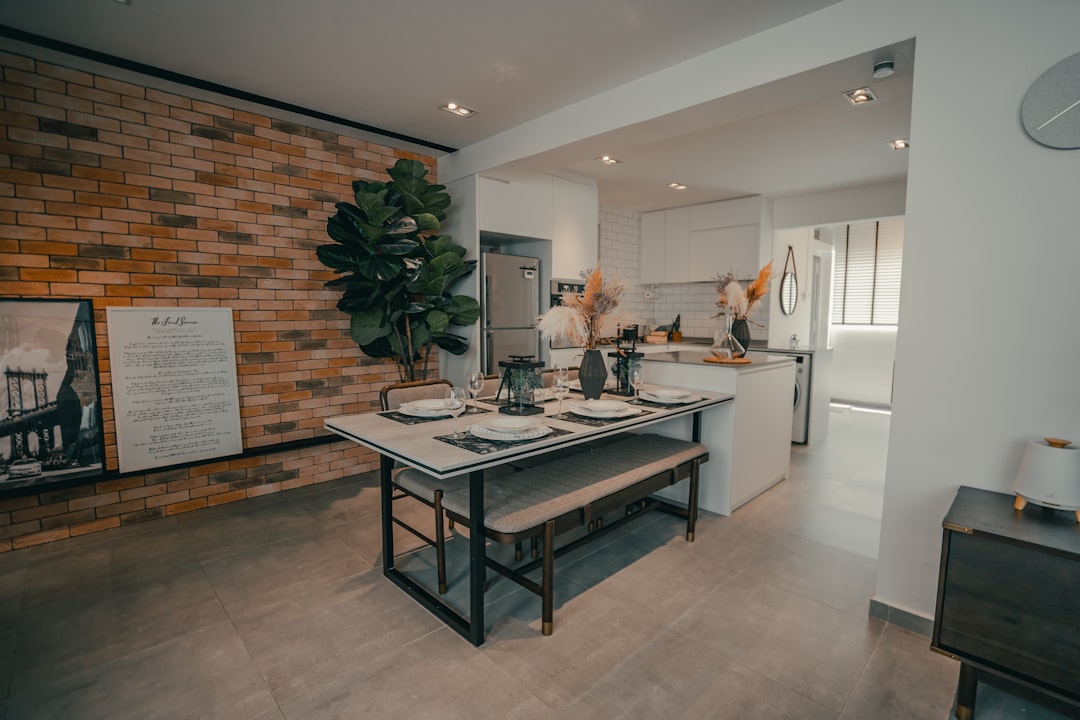 A laptop displaying a modern, user-friendly real estate website for home sellers.